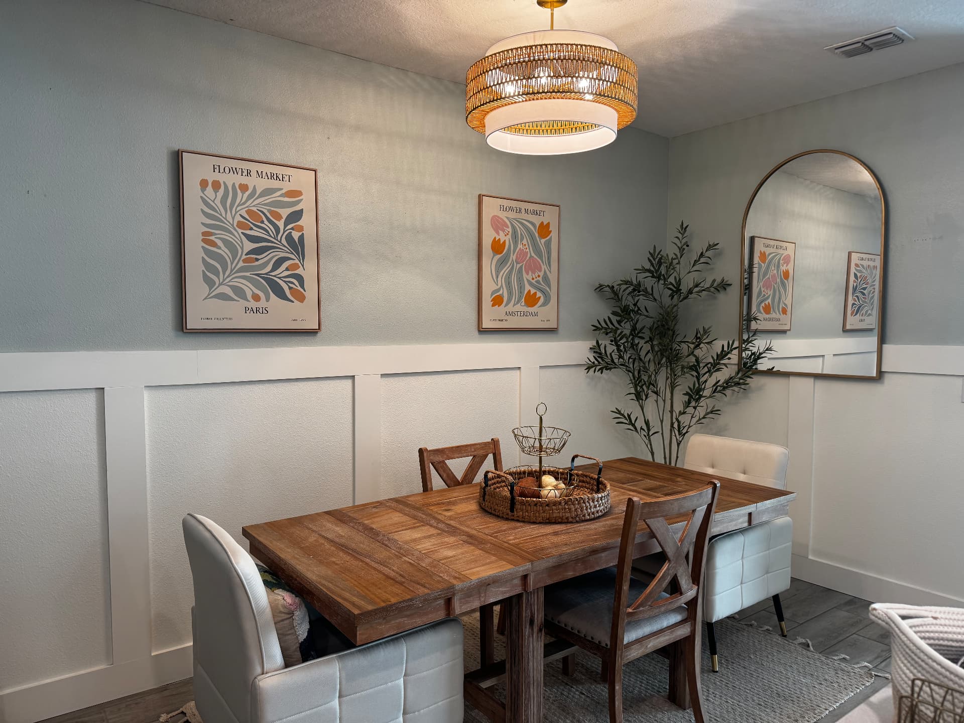 White board-and-batten statement wall in a Dora Wall Co. dining room