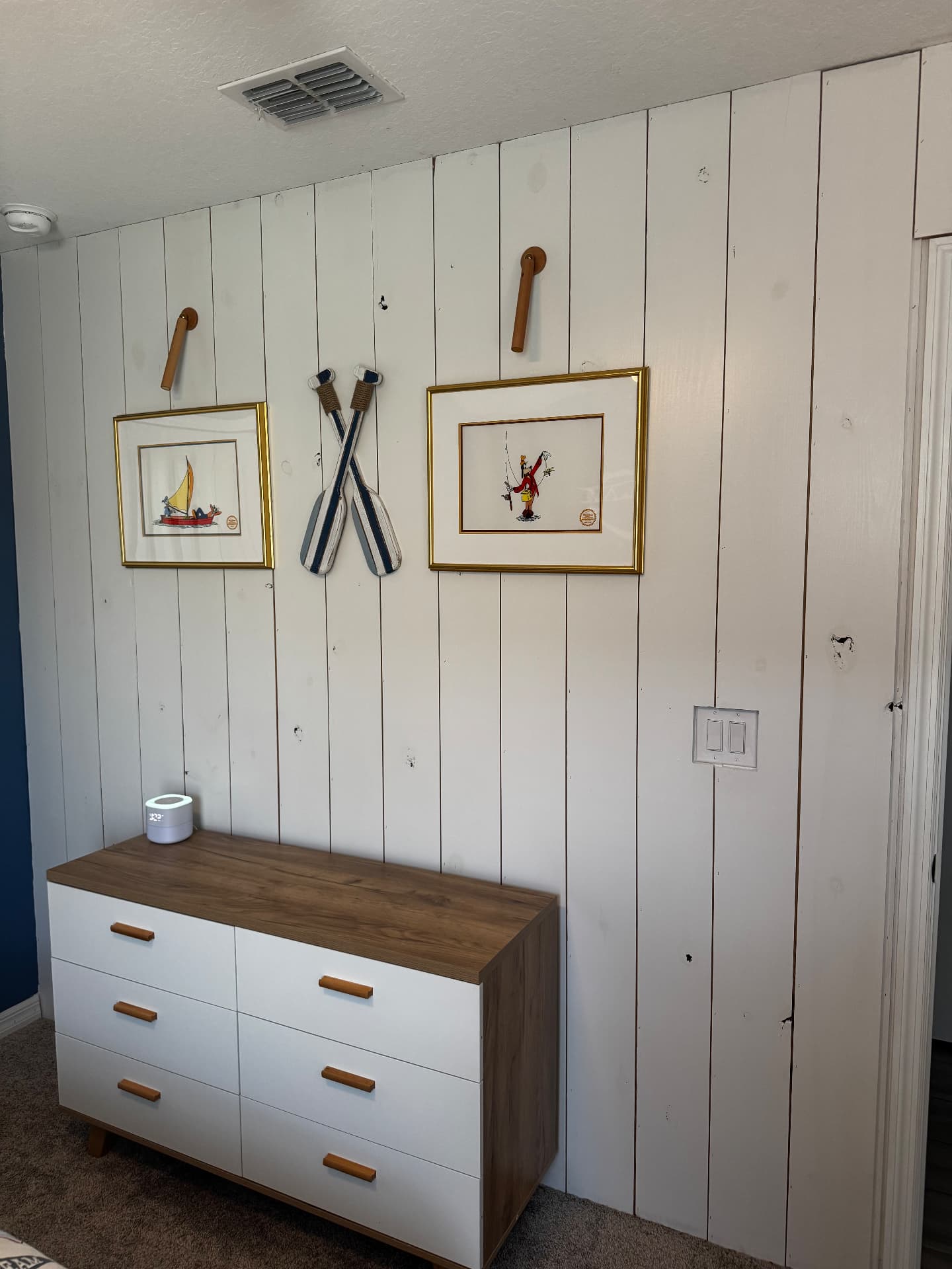 Vertical plank accent wall installed by Dora Wall Co.